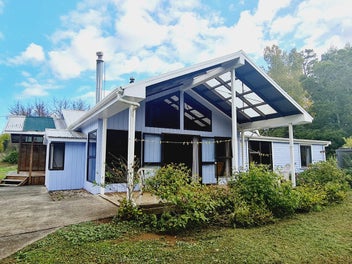 2 Titles! 4 bed 2 bath On 1 Acre + 2 ha = $620,000