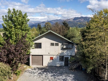 Elevated views and exceptional garaging!