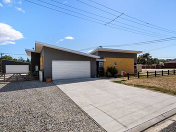 A Modern Delight with 4 car garaging!