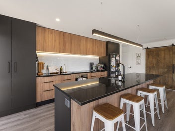 Inviting Black Facade with Modern Family Comfort!