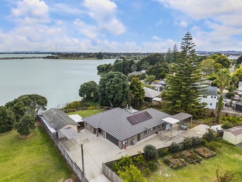 Waterfront Sanctuary with Income Potential !