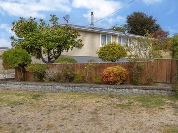 WEATHERBOARD FAMILY HOME ON LARGE SECTION.
