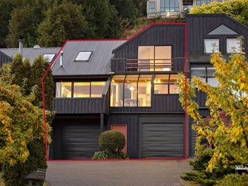 Lake views, two garages – rare townhouse find