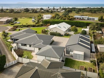 Car Enthusiast's Dream Plus a Signature Home