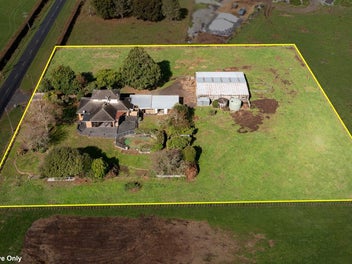 Brick home plus large shed/stables on flat land.