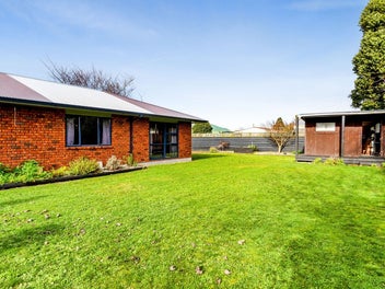 Five-bedroom, two-bathroom brick home