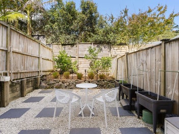 RENOVATED TWO-LEVEL UNIT. PRIVATE YARD, OWN GARAGE