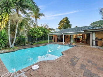 A Private Family Oasis with Poolside Living on...