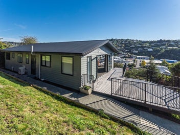 Must see - elevated and modern home with views!