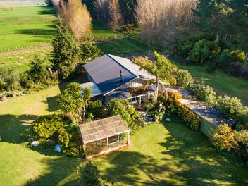 A Coastal Off-Grid Oasis - On 2 Titles!