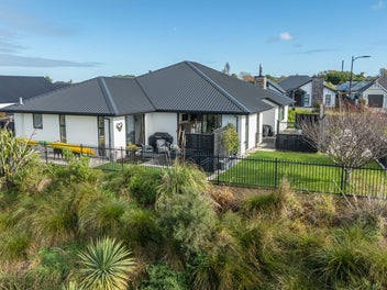 Picturesque Wetlands Setting With 3 Car Garaging!
