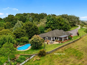 Exceptional living with pool, views and income