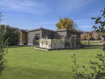Manicured acreage with home and income