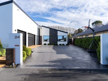 ARCHITECTURAL MASTERPIECE WITH TRIPLE GARAGING!