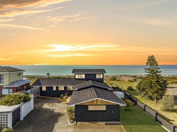 Absolute Beachfront Living with Potential