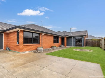 Stylish, Sleek, Triple car garage and Brick!
