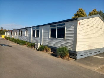 A 20 YEAR OLD 80SQM CLASSROOM TRANSPORTED & PILED