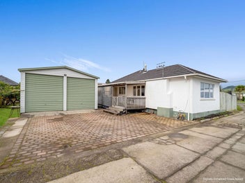 Huge Garage And A Renovation Ready Two-Bedroom
