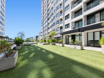 Sophisticated Top-Floor Living with Dual Parking