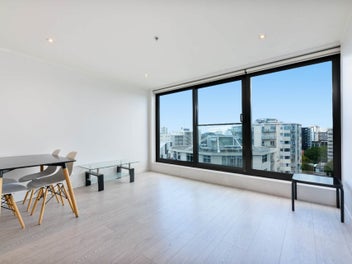 Sophisticated Top-Floor Living with Dual Parking