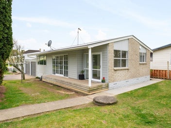 Spacious Street-Front Home with Added Potential