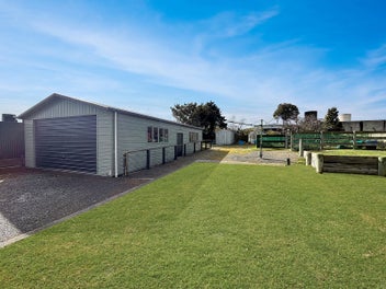Warm home with garaging on large section