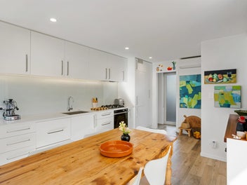 Elegant coastal living steps from lagoon