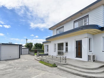Large Home With Six Car Garaging!