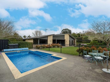 Dual Master Suites with Triple Car Garaging!