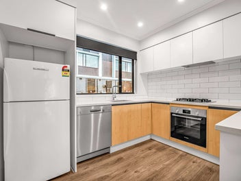 Central Living 3 Storeys High with Convenience!