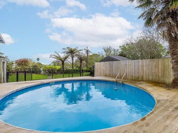 Family living on two titles with a pool