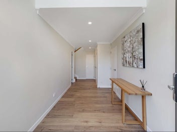 Coastal Brick Home with Dual Kitchens