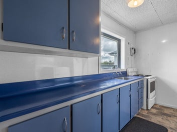 Tidy 2 bedroom home with extensive backyard