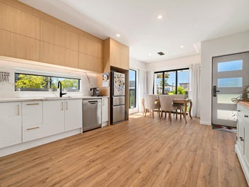 Bright Corner Home with Green Walkway at Your Door