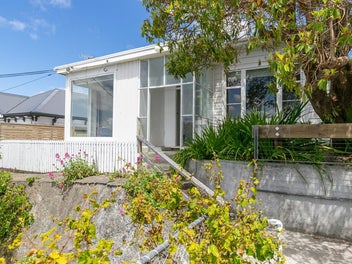 Home & Income with Views & Potential