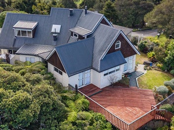 Water + bush views + large family home