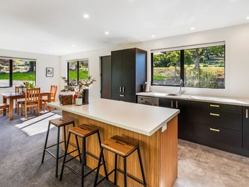 NEAR NEW HOME WITH WIDE OPEN VIEWS