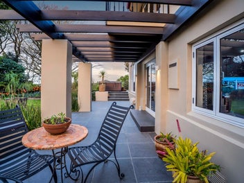 Outdoor living perfection with pool & river views