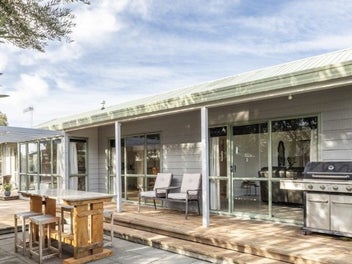 Warm, sunny living just steps from the beach!