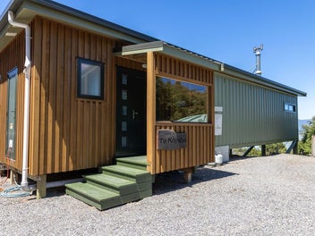 Off-grid container home with lake views