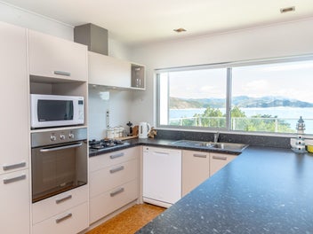 Hidden beach bach with panoramic ocean views