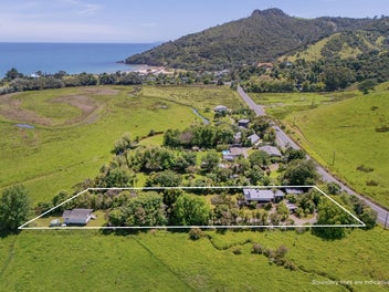 Lush Coastal Oasis with Dual Living on One Acre