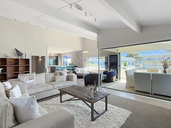 Sophisticated coastal retreat steps from the surf