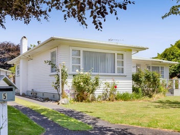Solid 1950s Home with Space, Privacy & Potential