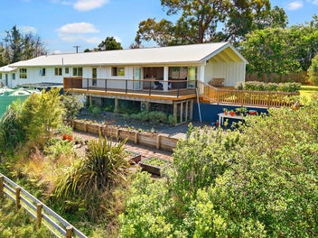 METICULOUSLY RENOVATED ON ONE ACRE OF LAND