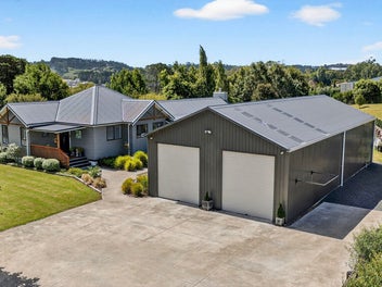 Coastal acre lifestyle, with serious garage space!
