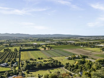 Elevated family oasis with private tennis court