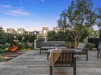 Willis Bond living, framed by greenery