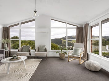 Sun-soaked brick home with rural outlook