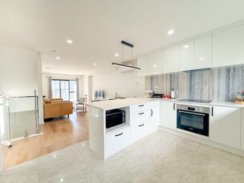 Spacious Sunny Living besides Shopping Mall